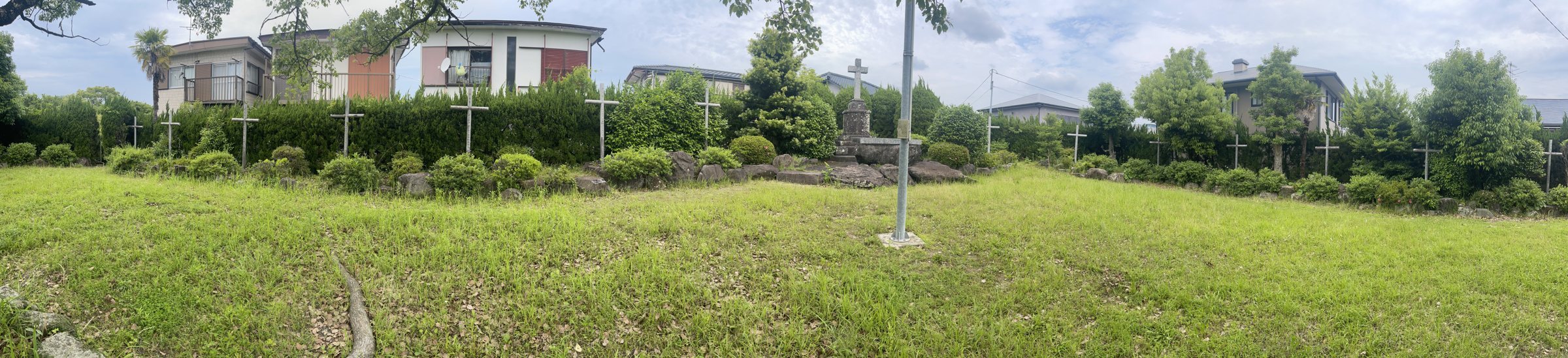 The top of the hill, with the cross in the middle and the iron Stations of the Cross around the edge